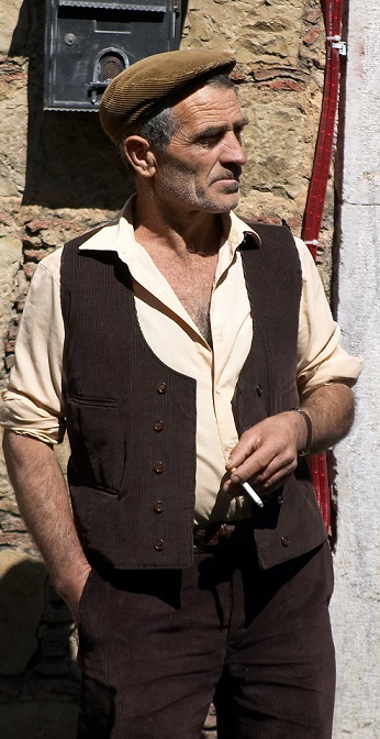 A man wearing a "coppola", a traditional kind of flat cap worn in Sicily